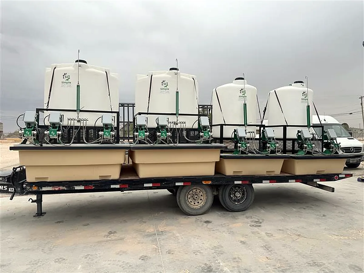 Four chemical injection skids on a trailer ready for delivery