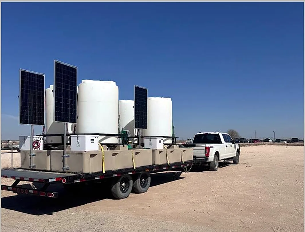 Trailer loaded with solar powered chemical injection skids
